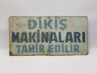 DİKİŞ MAKİNALARI TAMİR EDİLİR YAZILI TABELA